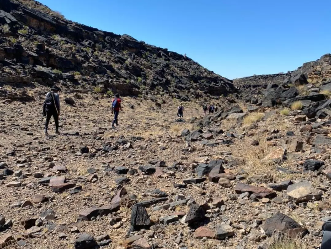 Hikers crossing the rocky floor of Fish River Canyon
